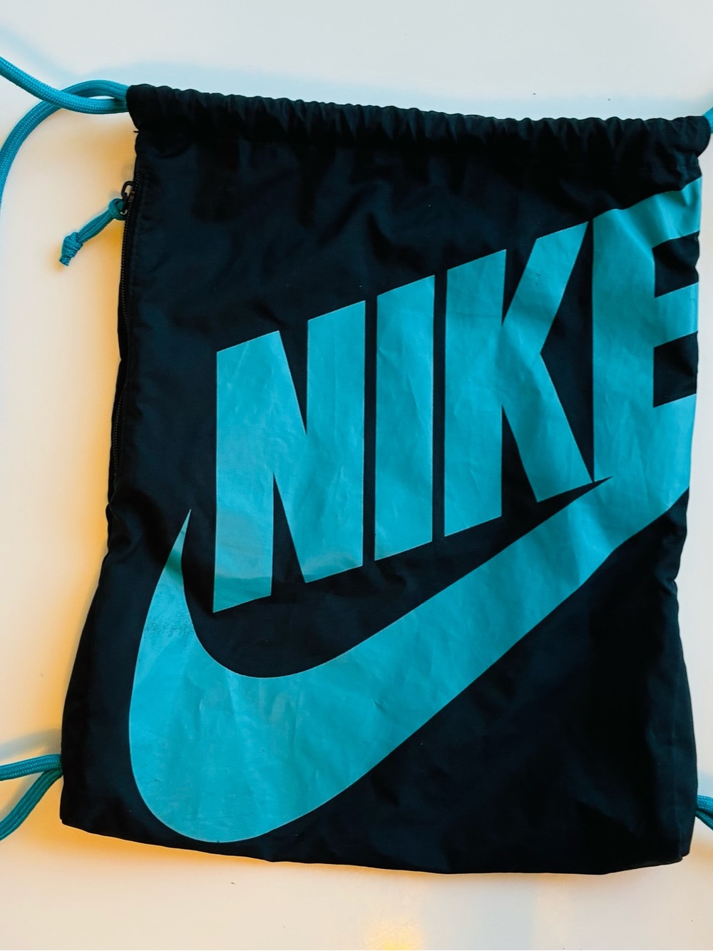 Nike Black Drawstring Backpack with Teal Logo